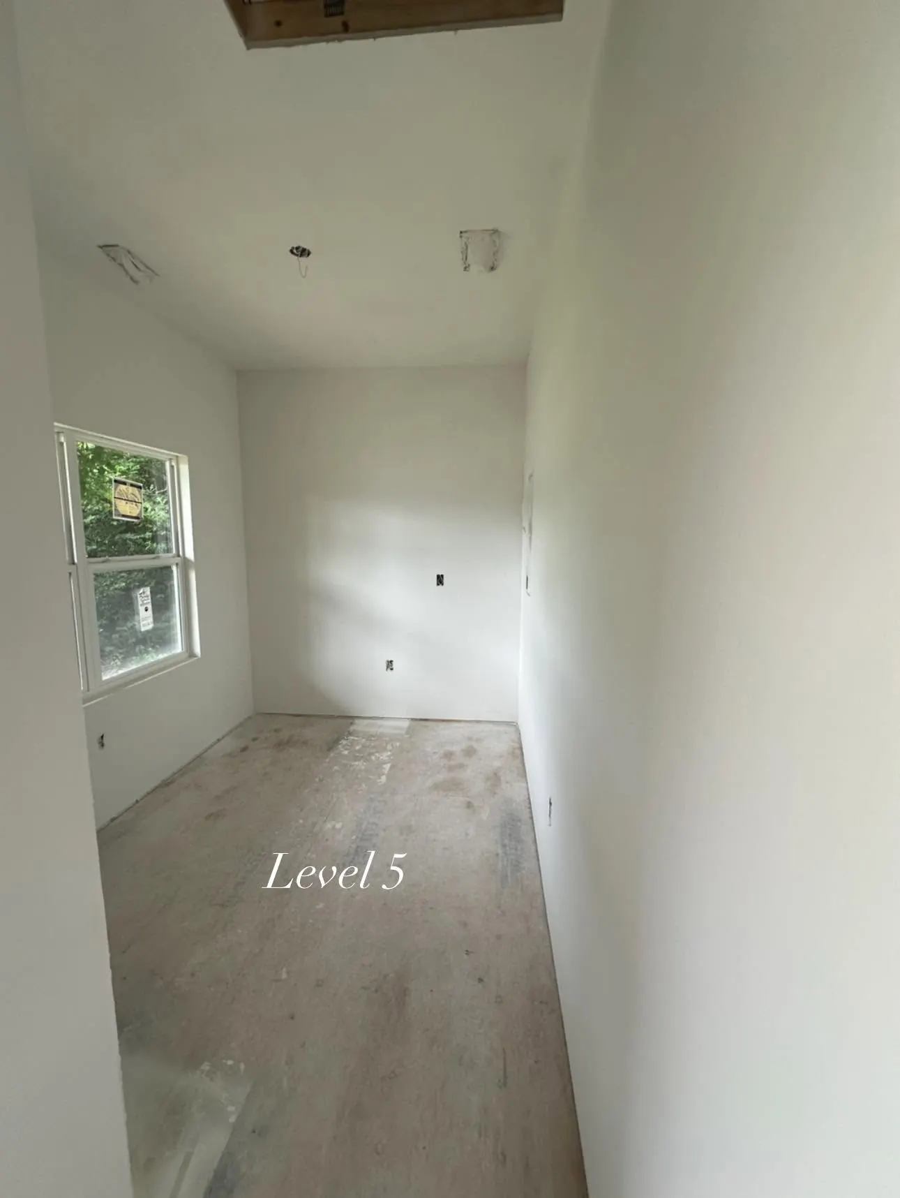 Narrow room with a completed Level 5 drywall surface