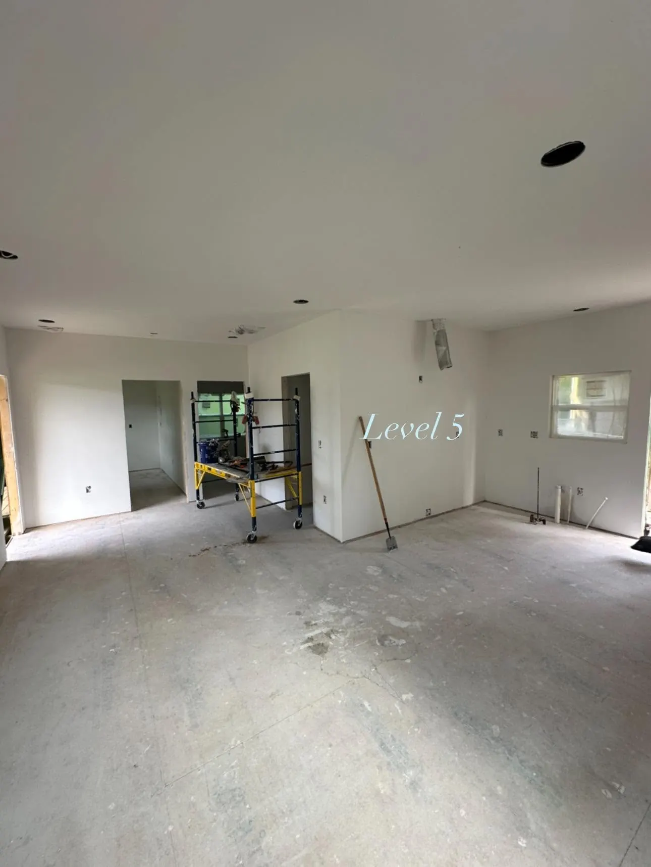 Large Western North Carolina room with a smooth Level 5 drywall finish